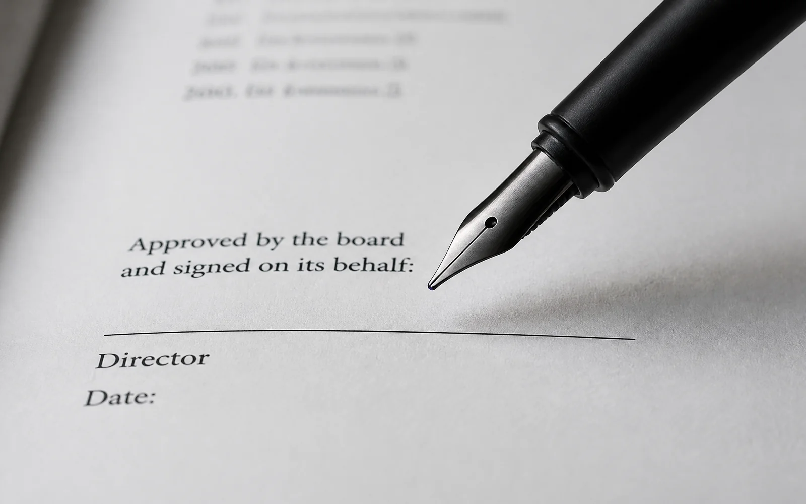 A fountain pen poised above the signature line of a set of accounts